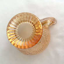 Load image into Gallery viewer, Vintage Iris iridescent flora gold glass creamer and covered sugar. Crafted by Jeannette Glass, USA, 1960s. The beautifully detailed glassware makes a lovely addition to any tablescape!
In excellent condition, no chips.
Creamer measures 3 1/2 x 3 (not including spaVintage Iris iridescent flora gold glass creamer and lidded sugar. Crafted by Jeannette Glass, USA, 1960s. The beautifully detailed glassware makes a lovely addition to any out/handle)
Sugar measures 3 3/4 x 5 1/2 inches (not including handles)