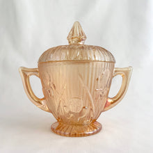 Load image into Gallery viewer, Vintage Iris iridescent flora gold glass creamer and lidded sugar. Crafted by Jeannette Glass, USA, 1960s. The beautifully detailed glassware makes a lovely addition to any tablescape!
In excellent condition, no chips.
Creamer measures 3 1/2 x 3 (not including spout/handle)
Sugar measures 3 3/4 x 5 1/2 inches (not including handles)