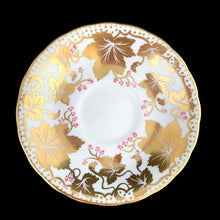 Load image into Gallery viewer, A gorgeous white bone china teacup and saucer featuring gold gilt ivy leaves and trim with pink berries florals. Crafted by Royal Chelsea, England, 1940s. A lovely addition to any china collection!
In excellent vintage condition, no chips, cracks or repairs.
Teacup measures 3 1/2 x 2 5/8 inches
Saucer measures 5 1/2 inches