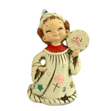 Load image into Gallery viewer, Josef Originals Libra Zodiac wizard figurine, front view, cream ceramic robe decorated with hand-painted multicolour stars, moons, suns, and crosses, red textured collar, right hand holding a cloud-shaped Libra symbol medallion with pink Libra glyph, white wizard hat with celestial motifs