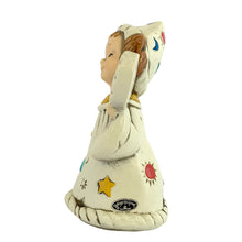 Load image into Gallery viewer, Josef Originals Virgo Zodiac wizard figurine, left side profile view, showing the tall pointed white wizard hat with teal stars, red dot, and blue crescent moon motifs, brown braided hair, cream robe with red suns and teal stars, yellow collar, white background and Josef Originals sticker