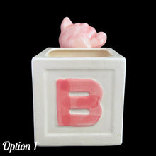 Load image into Gallery viewer, Vintage Kay Finch designed, hand painted ceramic figural pink teddy bear ABC baby block planter. Crafted by Shafford, Japan. Add this adorable planter to your nursery decor. Fill with a little plant or use to store baby care accessories. In as found vintage condition, see photos for details of imperfections. Measures 6 x 3 3/4 x 5 1/2 inches
