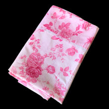 Load image into Gallery viewer, This lovely vintage "Kensington" pink flat bed sheet features a pattern pink roses and the band has a white lace detail. This 50% polyester / 50% cotton sheet fits a double/full sized bed. Crafted by Cannon Royal Family, USA, circa mid 1970s. A beautiful addition to your bedding collection, or repurpose for crafts, quilting or garment making. In excellent condition free from stains/tears. Original label present and colours are vivid and appears to be unused. Fits a double/full size mattress 81 x 104 inches