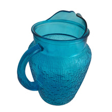 Load image into Gallery viewer, A selection of vintage mid-century modern "Pagoda" glass beverage pitcher in striking laser blue. Crafted by Anchor Hocking, USA, circa 1960s. This glassware features a unique bark-like texture and is the perfect addition to your Tiki or Chinoiserie style drink and barware! All pieces are excellent condition, free from chips.