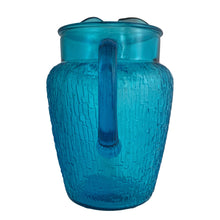 Load image into Gallery viewer, A selection of vintage mid-century modern "Pagoda" glass beverage pitcher in striking laser blue. Crafted by Anchor Hocking, USA, circa 1960s. This glassware features a unique bark-like texture and is the perfect addition to your Tiki or Chinoiserie style drink and barware! All pieces are excellent condition, free from chips.