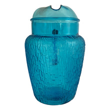 Load image into Gallery viewer, A selection of vintage mid-century modern "Pagoda" glass beverage pitcher in striking laser blue. Crafted by Anchor Hocking, USA, circa 1960s. This glassware features a unique bark-like texture and is the perfect addition to your Tiki or Chinoiserie style drink and barware! All pieces are excellent condition, free from chips.