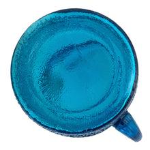 Load image into Gallery viewer, A selection of vintage mid-century modern "Pagoda" glass beverage pitcher in striking laser blue. Crafted by Anchor Hocking, USA, circa 1960s. This glassware features a unique bark-like texture and is the perfect addition to your Tiki or Chinoiserie style drink and barware! All pieces are excellent condition, free from chips.