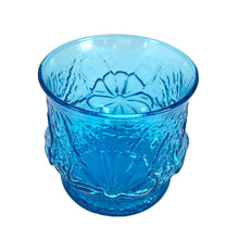 Load image into Gallery viewer, Anchor Hocking laser blue Rain Flower old fashioned glass, angled three-quarter view from above showing open rim and embossed floral pattern on exterior