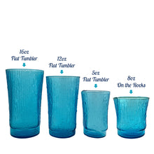 Load image into Gallery viewer, A selection of vintage mid-century modern "Pagoda" glass tumblers in striking laser blue. Crafted by Anchor Hocking, USA, circa 1960s. This glassware features a unique bark-like texture and is the perfect addition to your Tiki or Chinoiserie style drink and barware! All pieces are excellent condition, free from chips. 5oz Flat Tumblers Set of 6 - 12oz Flat Tumblers Set of 6 - 16oz Flat Tumblers Open Stock - 8oz On the Rocks Glasses