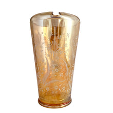 Load image into Gallery viewer, Gorgeous vintage mid century era iridescent marigold carnival glass pitcher featuring the "Late Sunflowers" pattern of wildflowers and ferns in white. Crafted by Jeannette Glass, USA, 1950s. The perfect way to serve your favourite beverage with vintage flare! In excellent condition, minor wear. Flea bites along the mold release at the interior rim, see photos. Measures 5 5/8 x 9 5/8 inches Capacity 56 ounces