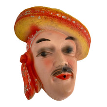 Load image into Gallery viewer, Charming and scarce, this vintage chalkware wall hung string holder featuring a handsome Latin American man wearing a red and yellow sombrero and scarf was a pleasure to find in such amazing condition! Dates to the 1940s. A wonderfully decorative piece! In excellent vintage condition with minor wear to the paint, no chips/cracks/repairs. Measures 6 1/4 x 2 3/4 x 7 3/8 inches