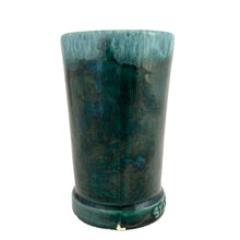 Load image into Gallery viewer, Side view of Laurentian Pottery cup displaying signature green drip glaze texture and chip at the base