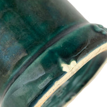 Load image into Gallery viewer, Detail of chip to base on 1960s vintage Laurentian Pottery Star Weekly cup, authentic wear