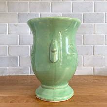 Load image into Gallery viewer, Opposite side view of the vase showing the handle and a hairline crack running down from the rim