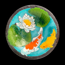 Load image into Gallery viewer, Exquisite vintage fused art glass bowl, featuring a colourful pond scene with vibrant Koi fish and elegant water lilies. Designed by talented artisan Peggy Karr who operated one of the USA's premier fused glass studios from 1987 - 2016. Whether for serving or as home decor, this vivid colour palette adds a burst of energy to any space, making it a must-have for every art lover! In excellent condition, free from chips. Signed by the artist. Measures 13 x 2 1/2 inches