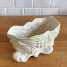 Load image into Gallery viewer, Vintage "Lily of the Valley" Parian porcelain candy dish with embossed blossoms and foliage highlight with green lustre and gold gilt detail. Crafted by Belleek, Ireland, 1980 - 1992 (7th mark). A beautiful collector piece! In excellent condition, free from chips/cracks/repairs. Gold Mark Measures 5 3/4 x 2 3/4 x 2 1/2 inches