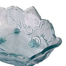 Load image into Gallery viewer, Vintage mid-century "Lombardi" pale blue footed bowl was part of the Cameo Line of glassware, crafted by Jeanette Glass, USA, circa 1950s. A lovely design featuring swirls of leaves with a central cameo, flared scalloped edge and sweet curled feet. Perfect for candy, snacks or use as a serving bowl and even a planter! In excellent condition, free from chips. Measures 10 1/2 x 6 3/4 x 5 1/4 inches