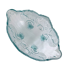 Load image into Gallery viewer, Vintage mid-century "Lombardi" pale blue footed bowl was part of the Cameo Line of glassware, crafted by Jeanette Glass, USA, circa 1950s. A lovely design featuring swirls of leaves with a central cameo, flared scalloped edge and sweet curled feet. Perfect for candy, snacks or use as a serving bowl and even a planter! In excellent condition, free from chips. Measures 10 1/2 x 6 3/4 x 5 1/4 inches