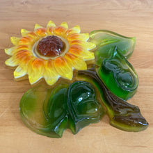 Load image into Gallery viewer, Brighten up your decor with this delightful vintage lucite wall plaque of a yellow, orange and green sunflower! Handmade by Ideal Gifts, circa 1970s. This piece has a metal hanger on the back for ease of displaying on a wall. This happy flower will certainly brighten up your decor! In excellent condition! Original sticker. Measures 8 x 9 1/4 inches