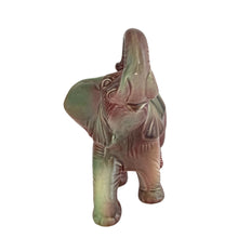 Load image into Gallery viewer, Vintage mid-century era figural lucky elephant ceramic plant in shakes of cranberry, green, yellow and gray. Marked Made in USA. Bring some luck to your gardening with this sweet, trunk up, planter!
In excellent condition, no chips/cracks/repairs.
Measures 9 x 4 x 7 7/8 inches
