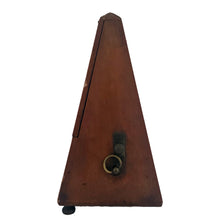 Load image into Gallery viewer, Classic obelisk shaped antique mahogany cased Metronome with brass fittings. Designed and patented by Maëlzel and manufactured by Paquet, France, early 20th century. Serial number 353.455. The brass plate on the cover reads, Paris, France, Angleterre, Amérique, Hollande, Belgique. Remove the cover to reveal the steel timing arm and tempo scale against a dark stained background.