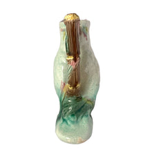 Load image into Gallery viewer, Antique majolica figural white and pink cockatoo parrot ceramic pitcher with green botanical base and brown bamboo-style handle. Crafted by Georges Jones, England, in the late 19th century (1880s). A wonderful piece of whimsical majolica for any collector and lends itself nicely to a tropical or Tiki themed decor!
In good used vintage condition, no chips. Age-related crazing and typical manufacturing glaze bubbles present. See photos.
Measures 5 x 2 1/2 x 6 inches