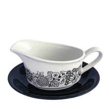Load image into Gallery viewer, Vintage "Manitou" ironstone features a white gravy boat with a graphic floral illustration in black with a black underplate. Crafted by Grindley, England, 1960s. In excellent condition, no chips/cracks/repairs. Gravy boat measures 5 3/4 x 3 1/4 x 3 1/2 inches (not incl. handle) Underplate measures 7 1/2 x 5 1/2 inches
