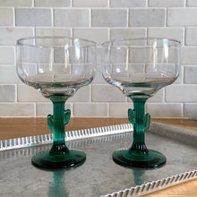Load image into Gallery viewer, Pair of vintage Margarita Cactus cocktail glass featuring a green figural Saguaro cactus stem. Crafted by Libbey Glass, USA, 2006. Mix up some fabulous cocktails and kick back with these fun glasses....olé! In excellent condition, free from chips. Measures 4 1/4 x 6 1/4 inches Capacity 16 ounces