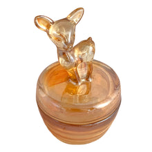 Load image into Gallery viewer, Close-up of marigold carnival glass powder jar lid featuring raised deer fawn relief, Jeannette Glass vintage glassware