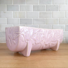 Load image into Gallery viewer, Vintage Art Deco matte pink Butterfly Line fernery. Crafted by Nelson McCoy Pottery, early 1940s. This rare piece is must for any McCoy art pottery collector!
In excellent condition, tiny flea bite on interior rim, no chips/cracks/repairs. Maker's mark.
Measures 8 1/2 x 4 x 3 3/8 inches