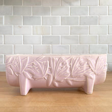 Load image into Gallery viewer, Vintage Art Deco matte pink Butterfly Line fernery. Crafted by Nelson McCoy Pottery, early 1940s. This rare piece is must for any McCoy art pottery collector!
In excellent condition, tiny flea bite on interior rim, no chips/cracks/repairs. Maker's mark.
Measures 8 1/2 x 4 x 3 3/8 inches
