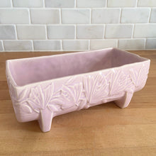Load image into Gallery viewer, Vintage Art Deco matte pink Butterfly Line fernery. Crafted by Nelson McCoy Pottery, early 1940s. This rare piece is must for any McCoy art pottery collector!
In excellent condition, tiny flea bite on interior rim, no chips/cracks/repairs. Maker's mark.
Measures 8 1/2 x 4 x 3 3/8 inches