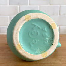 Load image into Gallery viewer, Jacks Daughter of All Trades Vintage Antique Mid-Century Kitsch Store Shop Reseller Etsy Shopify Toronto Canada Free Porch Pick Up Local Delivery Worldwide Shipping Judy Weinberg Unique Housewarming Gift Sustainable Gift Wedding Gift Home Decor Collectible Collector Gift Farmhouse Cottagecore Cottage Lodge Shabby Chic Industrial Hollywood Regency Art Deco Art Nouveau matte turquoise vase with decorative handle McCoy Pottery 1950s rare art pottery