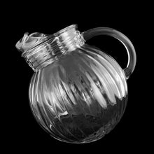 Load image into Gallery viewer, This vintage "Melon" Ice Lip tilted ball beverage pitcher features a ribbed design on the ball and collar! Produced by Anchor Hocking, USA, circa 1950s. Its classic lines and capacity will take your beverage service to the next level! In excellent condition, no chips. Measures 6 inches to the spout, overall height 8 inches, the ball is approximately 6 1/4 inches Capacity 64 ounces