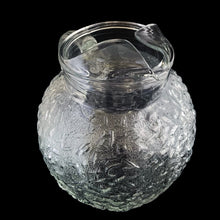 Load image into Gallery viewer, Vintage clear Miliano ice lip glass pitcher features a textured surface and ribbed handle. Crafted by Anchor Hocking, between 1960-1969. A true classic!
In excellent condition, no chips/cracks.
Measures 7 x 8 inches
Capacity 96 ounces
