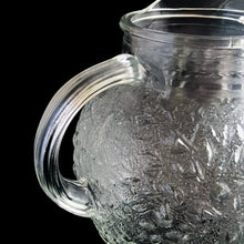 Load image into Gallery viewer, Vintage clear Miliano ice lip glass pitcher features a textured surface and ribbed handle. Crafted by Anchor Hocking, between 1960-1969. A true classic!
In excellent condition, no chips/cracks.
Measures 7 x 8 inches
Capacity 96 ounces