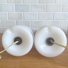 Load image into Gallery viewer, A beautifully shaped pair of vintage milk glass table lamps featuring hand painted flowers in orange, green and gold. Perfect for adding vintage charm to any space. In as found vintage condition, glass is free from chips/cracks, paint is worn. Tested and in working order. Measures 3 7/8 x 12 1/4 inches