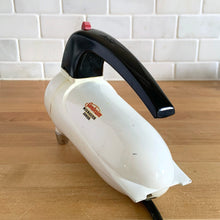 Load image into Gallery viewer, Fabulous vintage white and black Sunbeam Mixmaster Junior hand mixer, Model J. Crafted by the Sunbeam Corporation, USA, circa 1950. The power and quality craftsmanship of these mixers is unmatched and are made to last a lifetime. A must-have for any baker or appliance collector!
Tested. In good working order.
Mixer measures 7 1/4 x 3 x 6 inches (10 3/4 inches tall with beaters)