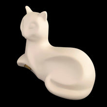 Load image into Gallery viewer, A striking example of vintage MCM craftsmanship, this matte cream art pottery cat embodies the minimalist aesthetic that defined 1960s modernism with its geometric lines and understated elegance. Crafted by the acclaimed Laurentian Pottery studio in Québec, Canada. Its sculptural form and subtle finish have earned it recognition among serious collectors of MCM design and Canadian ceramics, making it a coveted addition to curated collections.
Excellent condition, no chips/cracks/repairs. Original sticker.
