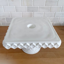 Load image into Gallery viewer, Top-down view of Indiana Glass Monterey milk glass square cake stand showing moulded diamond pattern and centre rum well