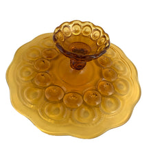 Load image into Gallery viewer, Vintage amber Moon and Star pressed glass low pedestal cake plate stand. Crafted by LE Smith Glass, USA, 1960s. This timeless cake stand with its heirloom-style craftsmanship is sure to be a conversation starter at any gathering!
In excellent condition, no chips.
Measures 11 3/4 x 3 3/4 inches