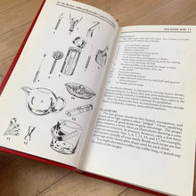 Load image into Gallery viewer, The original vintage Mr. Boston Official Bartender's and Party Guide written by Leo Cotton and published in 1935. This is the 1996 edition published by Warner Books, USA. A fantastic 272 page reference book jam packed with practical info and cocktail recipes to add to your bar. A great gift for any mixologist. This book makes it easy to whip up some mid-century cocktails!
In good used condition. There is typical foxing on the interior pages and a couple of small dog-tagged ears.
