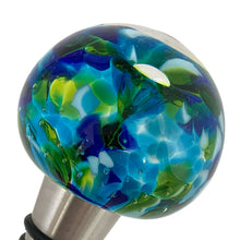 Load image into Gallery viewer, Close-up of Murano glass wine stopper showing delicate flower encased inside colorful blue and green art glass