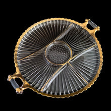 Load image into Gallery viewer, Vintage National 15 Inch round 6-part clear glass relish with handles and gold trim features a central hobnail section with ribs emanating to the edges, giving the appearance of a flower. Crafted by Jeannette Glass, USA. Perfect for serving veggies, dips or antipasto.
In very good vintage condition, no chips, with minor wear to the gold.
Measures 15 inches