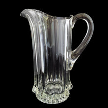 Load image into Gallery viewer, Antique National Glass Co. Hercules clear glass pitcher, side view showing ribbed body, applied handle, and pressed star base, c. 1904