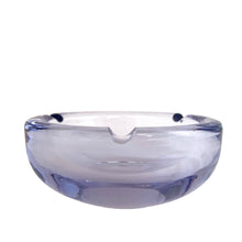 Load image into Gallery viewer, Vintage mid-century modern purple and blue alexandrite neodymium modernist art glass round ashtray. Bohemia Glass, Czechoslovakia, circa 1950s. The unique properties of alexandrite glass allow it to change colour in different types of light triggered by the use of Neodymium in the production of the crystal. Under fluorescent light, it appears blue and under incandescent or natural light, it appears purple. A stunning piece of art glass!
In excellent condition. Measures 4 3/8 x 1 7/8 inches