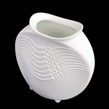 Load image into Gallery viewer, A delicate and elegant art nouveau style white bisque flower vase featuring embossed ocean wave design and glazed on the inside. Impressed "M. Frey" signature and shape number "678". Crafted by Kaiser, Germany. A lovely vase to fill with a sweet bouquet of fresh or dried flowers In excellent condition, free from chips/cracks/repairs. Measures 4 x 4 inches