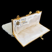 Load image into Gallery viewer, In overall excellent vintage condition. Appears unused, but there is discolouration in one spot on the exterior of the bag
Measures 5 1/4 x 5 3/4 inches, 5 1/2 inch handle drop