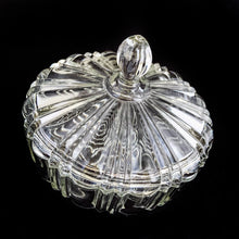 Load image into Gallery viewer, Vintage depression era Old Cafe clear glass lidded candy dish. Crafted by Anchor Hocking, USA, 1936 - 1940. Use this sculpted dish to store candies and nuts. Could be used as a dresser box on a vanity or night stand to store a cell phone and jewellery. Such a versatile piece to add sparkle to your home decor!
In excellent condition, no chips.
Measures 6 7/8 x 5 inches