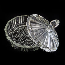 Load image into Gallery viewer, Vintage depression era Old Cafe clear glass lidded candy dish. Crafted by Anchor Hocking, USA, 1936 - 1940. Use this sculpted dish to store candies and nuts. Could be used as a dresser box on a vanity or night stand to store a cell phone and jewellery. Such a versatile piece to add sparkle to your home decor!
In excellent condition, no chips.
Measures 6 7/8 x 5 inches